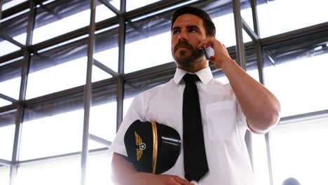 pilot talking on mobile phone