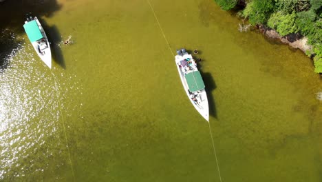 Drone-footage-of-a-boat-anchored-in-a-cove,-which-is-located-on-the-island-of-Chacachacare-in-Trinidad-and-Tobago