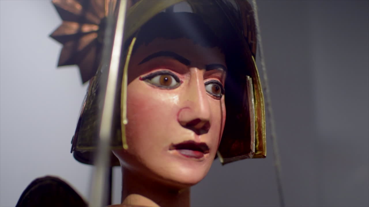 Close-up cinematic rotating shot of vibrant Sicilian puppets (pupi), showcasing their intricate details, colorful costumes, and expressive faces.