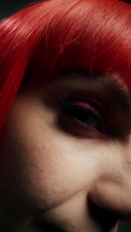 woman with red wig and pink makeup