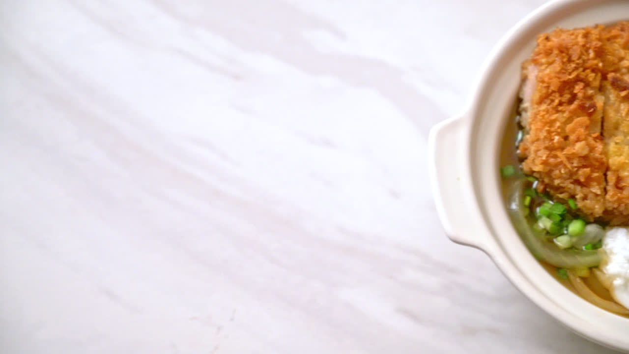 Japanese fried pork cutlet (katsudon) with onion soup and egg - Asian food style