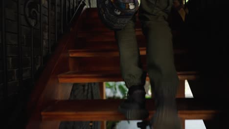 a person walking up a wooden staircase