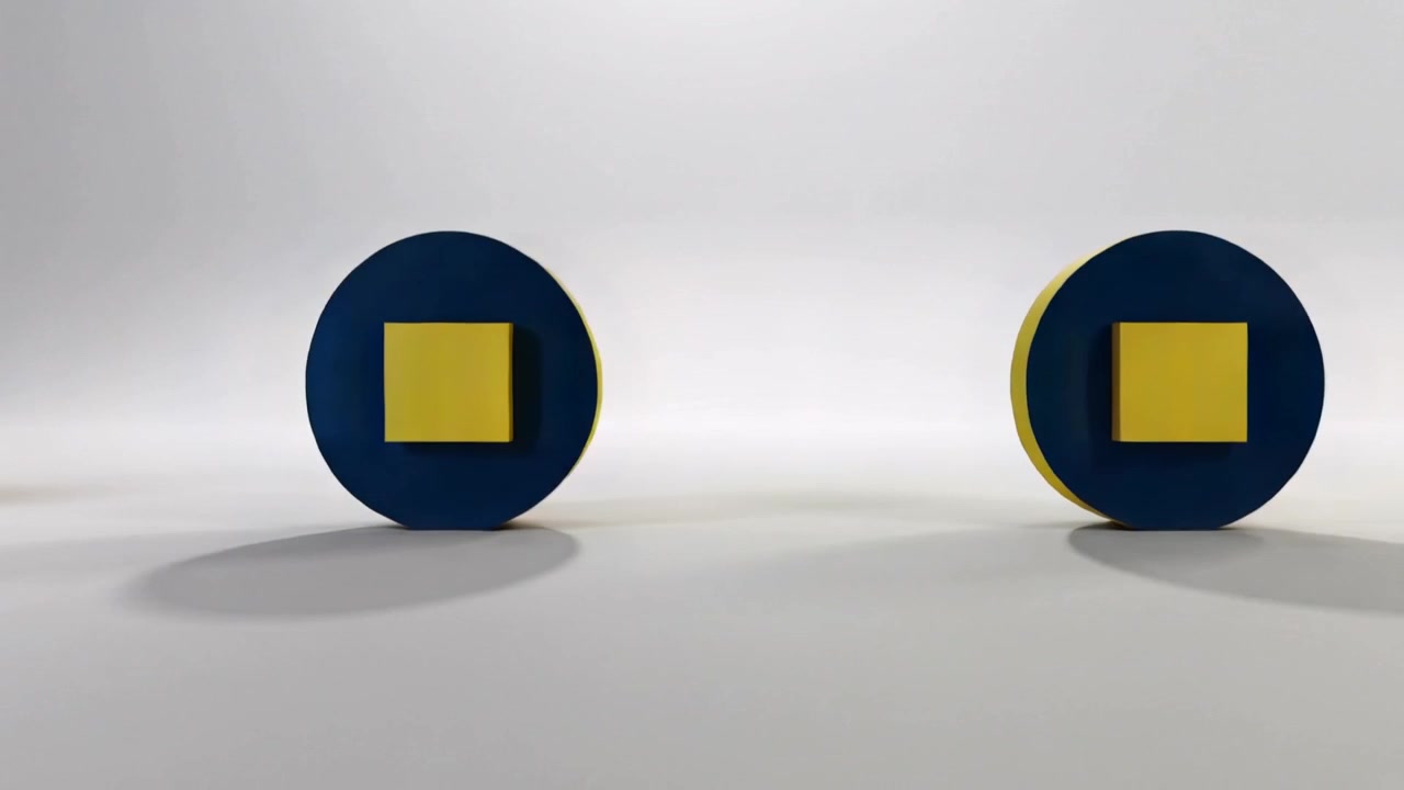 Rolling blue disks entering from off-frame on studio set, forming row with yellow square insets