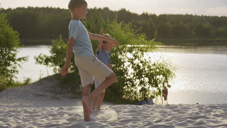 Father-and-sons-playing-on-the-beach