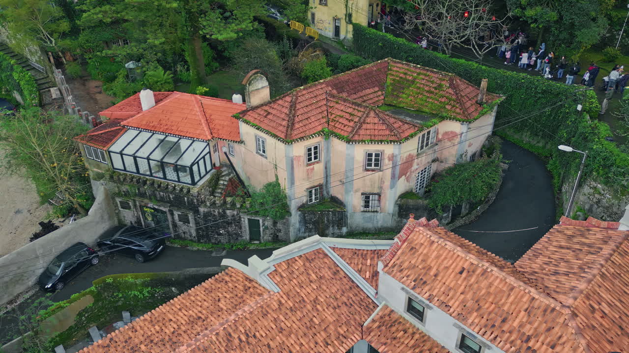 Vintage buildings surrounded trees at old village landscape drone shot.