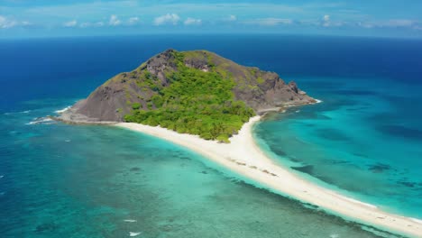 Aerial View of a Remote Tropical Island with White Sand Beach and Turquoise Water