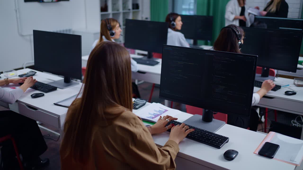 Women Working at Desk with Laptops