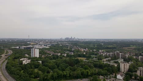 Aerial-footage-of-the-cityscape-of-Frankfurt-am-Main-on-a-cloudy-spring-day