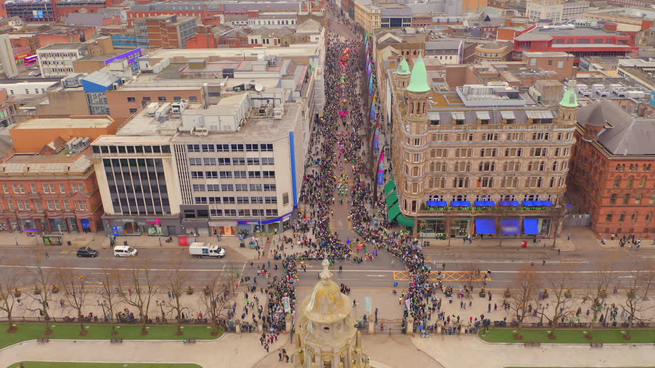 Aerial shot of the St. Patrick’s Day parade reaching its final stage at Belfast town hall