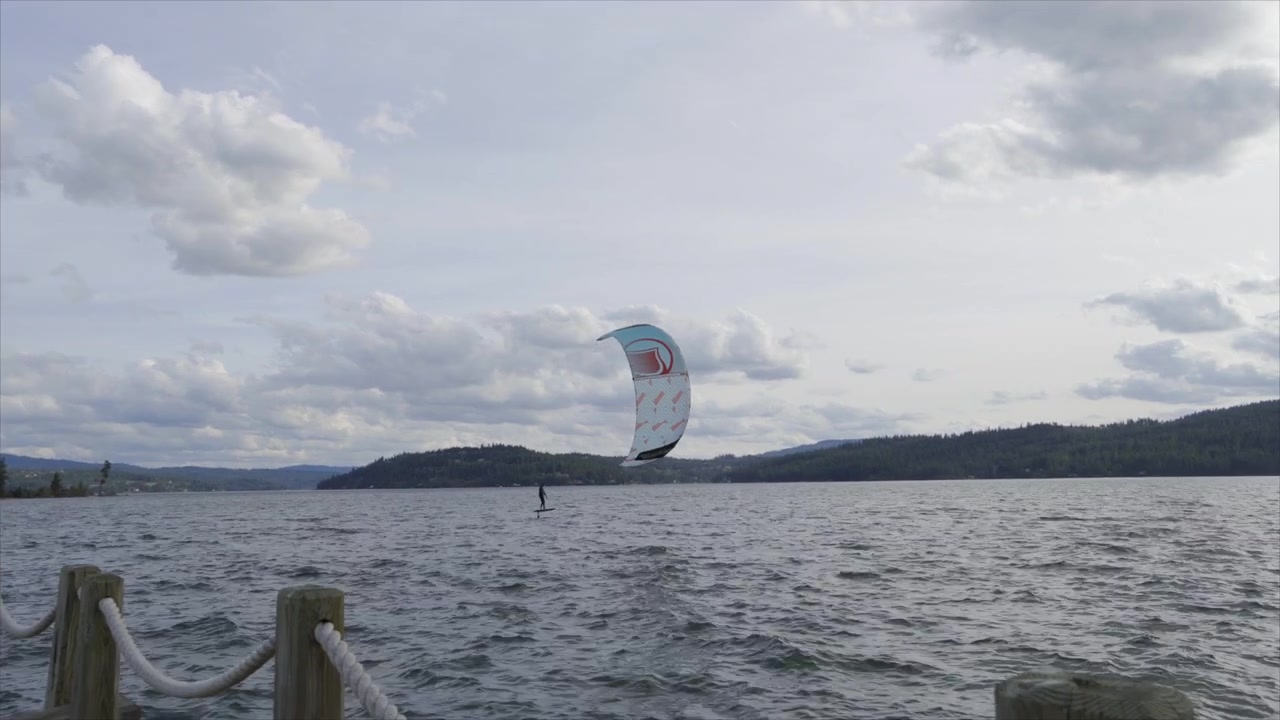 Kite surfer on lake. 4K footage 24fps