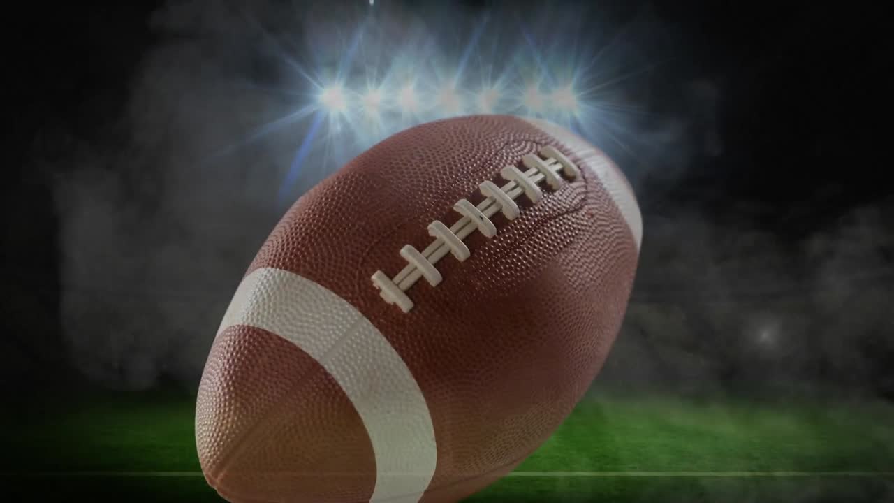 Animazione di palla da football americano su luci dello stadio