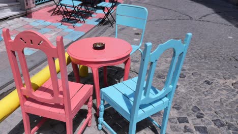 colorful outdoor cafe seating in a city street