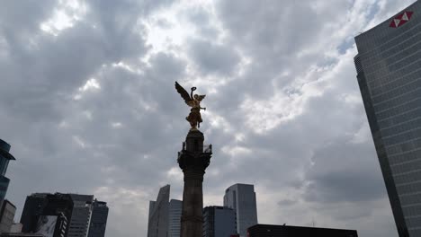 angel of independence surrounded by mexico city skyline