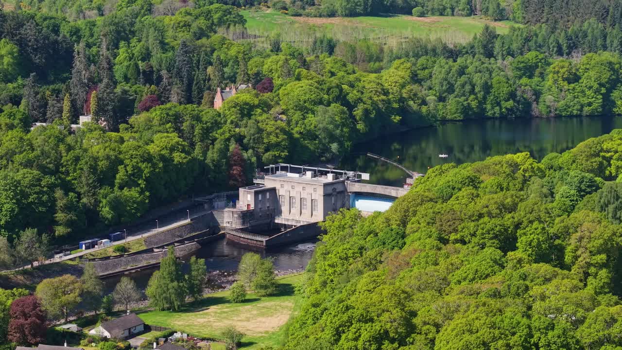 Revealing the natural landscape and the dam at Pitlochry village in Scotland, surrounded by lush greenery and highland scenery