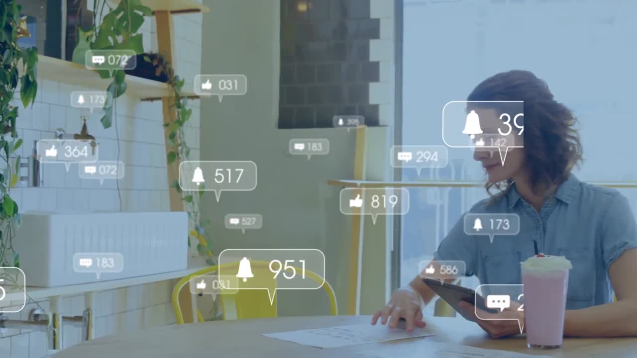 Animation of media icons over caucasian woman using tablet