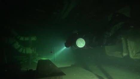 Diver-explores-flooded-equipment-room-in-nuclear-missile-silo