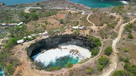 "stunning 4k drone footage of broken beach, nusa penida, bali. captures breathtaking cliffs, turquoise waters, and the iconic natural arch. perfect for travel, tourism