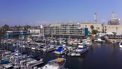 low aerial close-up shot of the leasing apartments at king harbor marina in redondo beach, california