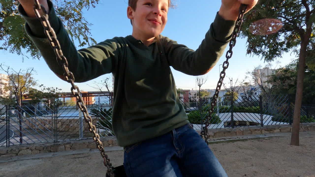 Teenage boy on a swing