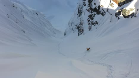 impressive footage of skier dropping down the mountain in the canadian wilderness