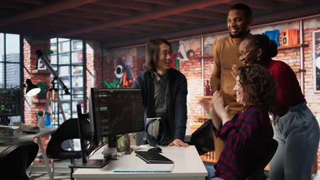 startup team cheering after seeing company stocks raising, doing high five