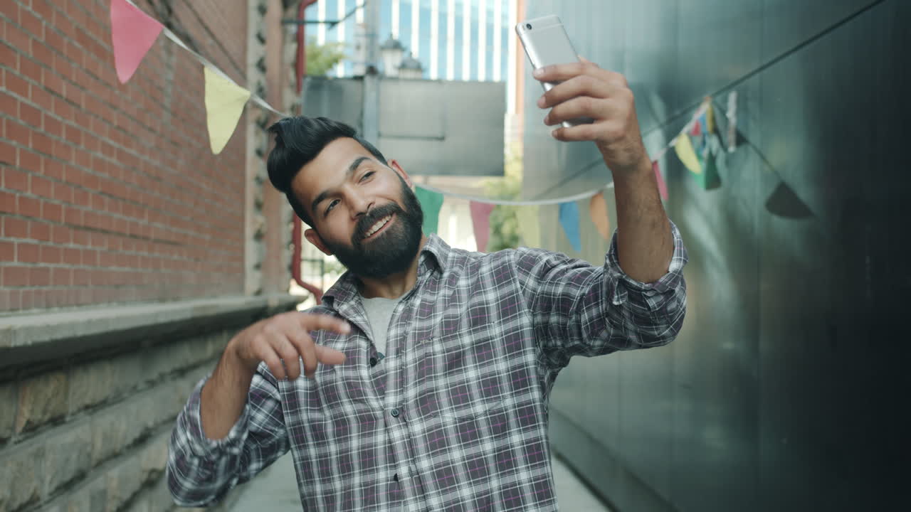 Man Taking Selfie in City Alley