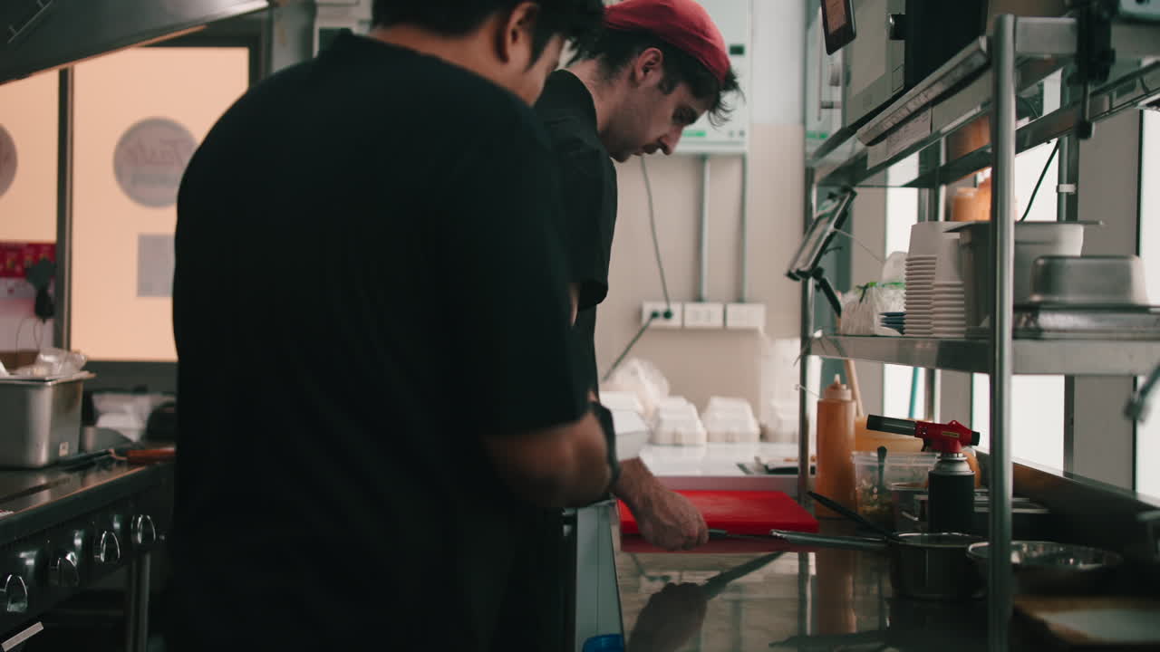 Restaurant Chefs Preparing Food in Commercial Kitchen