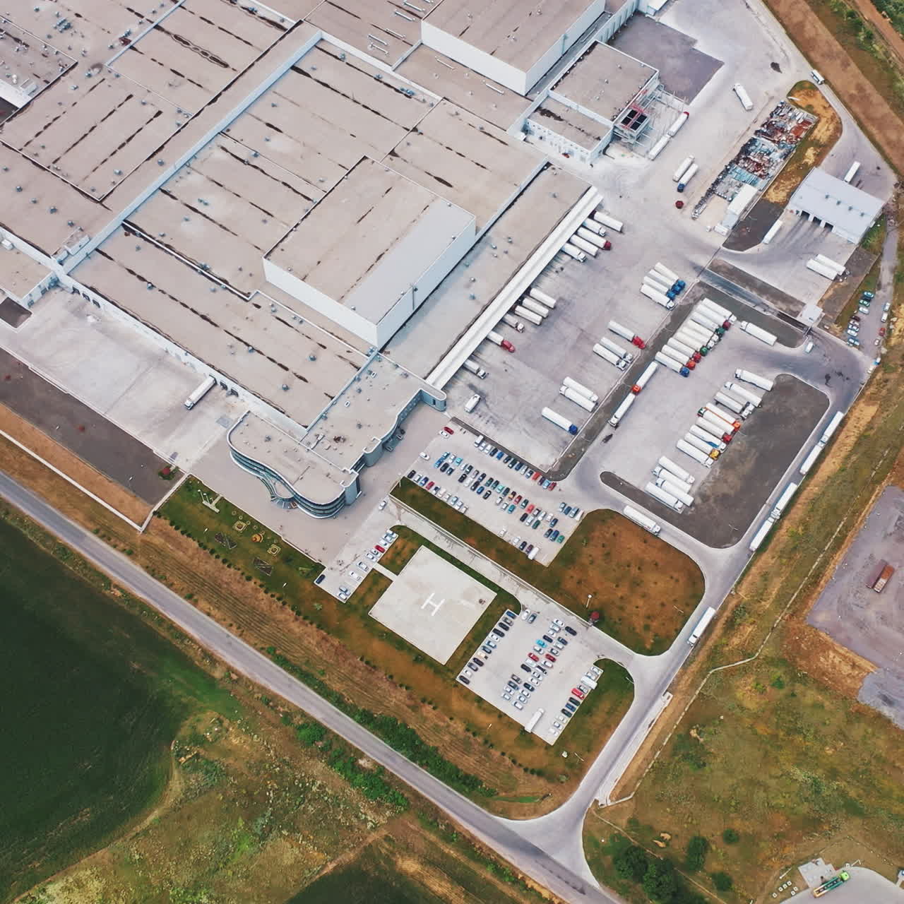 Modern Factory Exterior. Aerial footage of a large industrial complex.