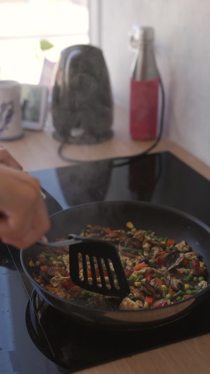 Cooking a vegetable stir fry in a pan