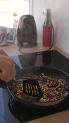 cooking a vegetable stir fry in a pan