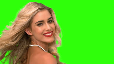 attractive woman tossing her hair on green screen