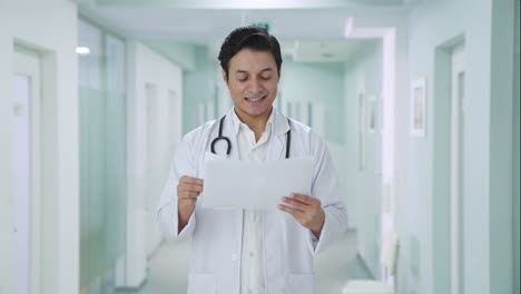Happy-Indian-doctor-checking-medical-reports