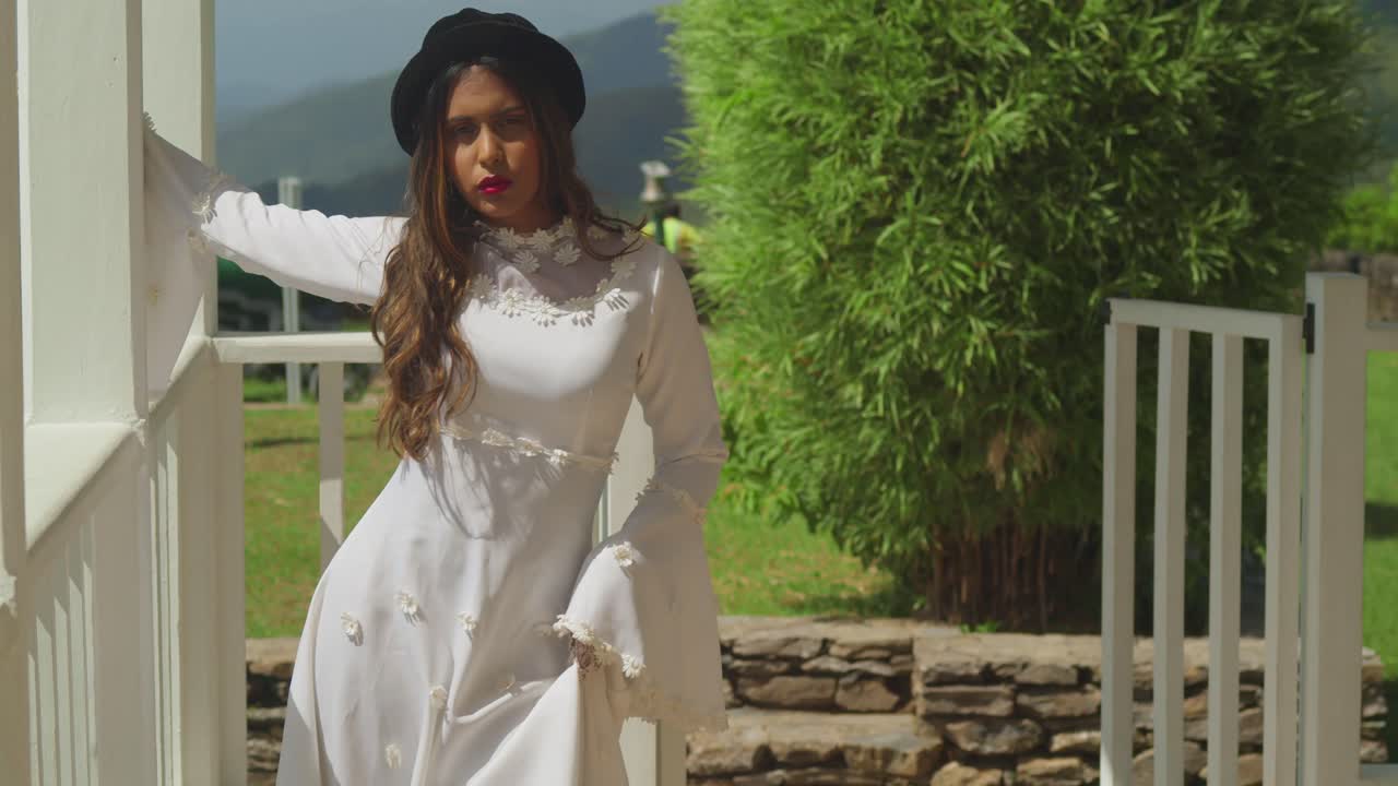 A girl in a classic bridal dress exploring the ruins of a historical fort.