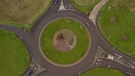 Top aerial shot of an Irish roundabout with moderate traffic