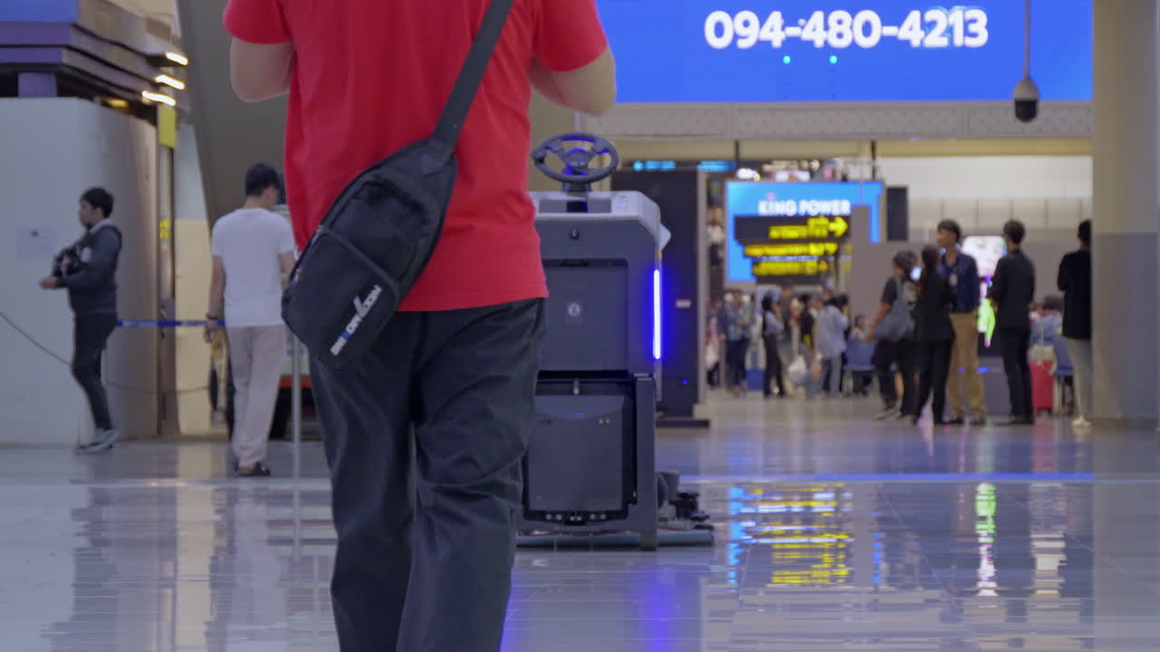 An automatic floor cleaning robot operates at Don Mueang Airport, Bangkok, ensuring a clean and smooth airport environment for passengers.