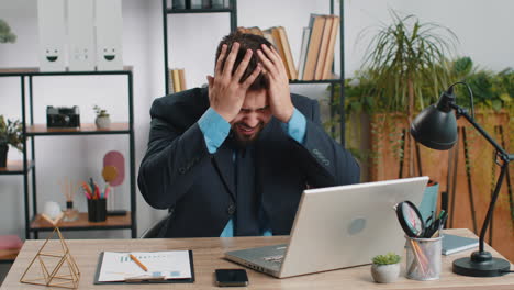 irritated tired businessman working on laptop website problem computer virus data loss by hacking