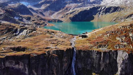 beautiful lake of weisssee connected to the waterfall in salzburg, austria