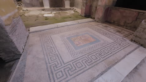 wide, tilt up from mosaic in excavated house in pompeii