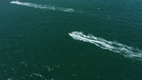 Tourists-Having-Fun-on-Vacation-Riding-Sea-Doos-in-Acapulco-Bay,-Mexico---Aerial