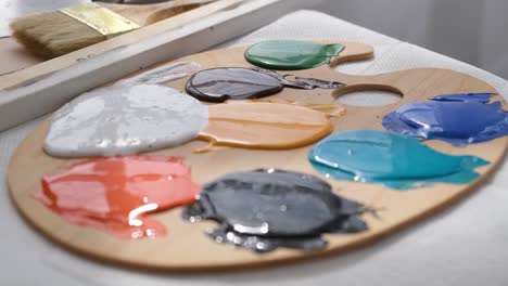 artist's palette with various paint colors