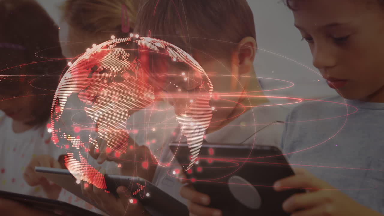 초등학교에서 디지털 태블릿을 사용하는 학생들의 그룹을 상대로 회전하는 지구