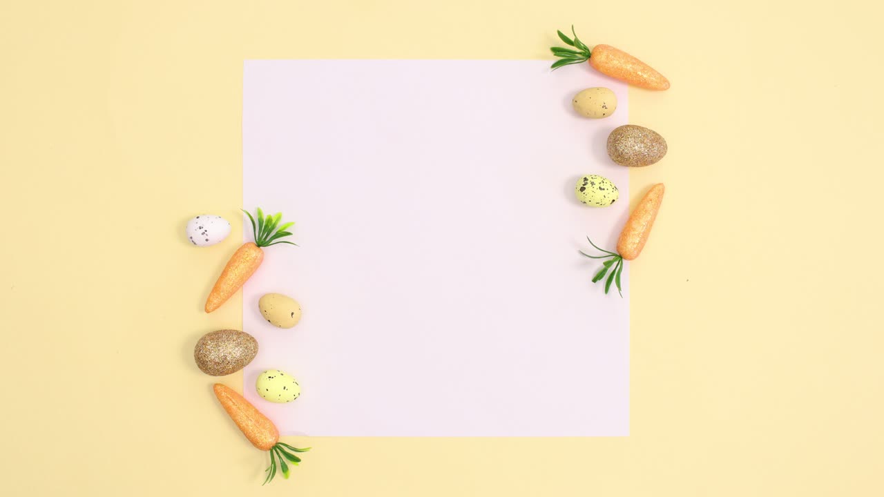 Gold and yellow Easter eggs and carrots appear on paper card note on bright yellow background. Stop motion flat lay minimal