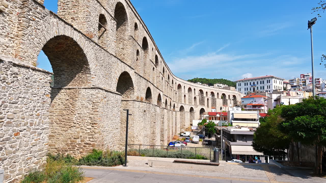 KAVALA, GREECE - SEPTEMBER 23, 2020: Streetscape of the town, viaduct over the roads and buildings, greenery