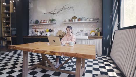 woman working from home in a cozy kitchen