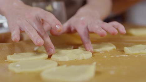 hands of woman forming dough