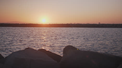 The-sun-sets-over-a-Long-Beach-canal