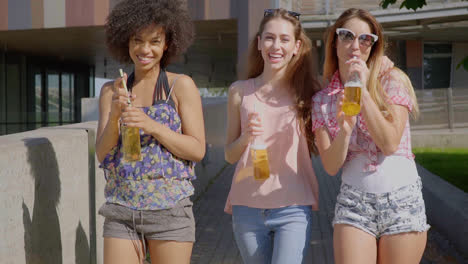 women walking and having beer