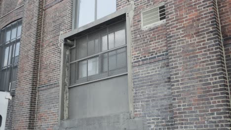 a warehouse loading dock bay showcases a vibrant display of multicolored red brick and a garage door