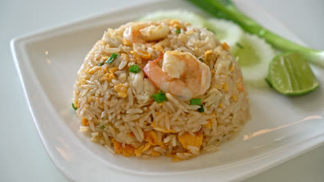 fried rice with shrimps and crab on white plate