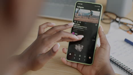 person using a smartphone with instagram app